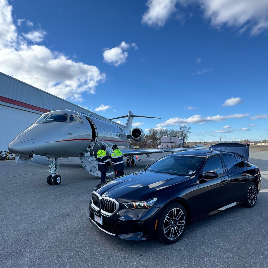 BMW luxury sedan at Atlantic Aviation FBO private jet transfer Boston